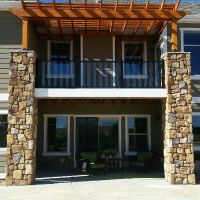 1728 5 Inch Glass Railing on Deck with Stone Columns and Pergola