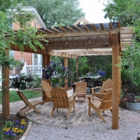 1708 Circular Brick Seating Area with Pergola Flagstone Steppers Gravel Path